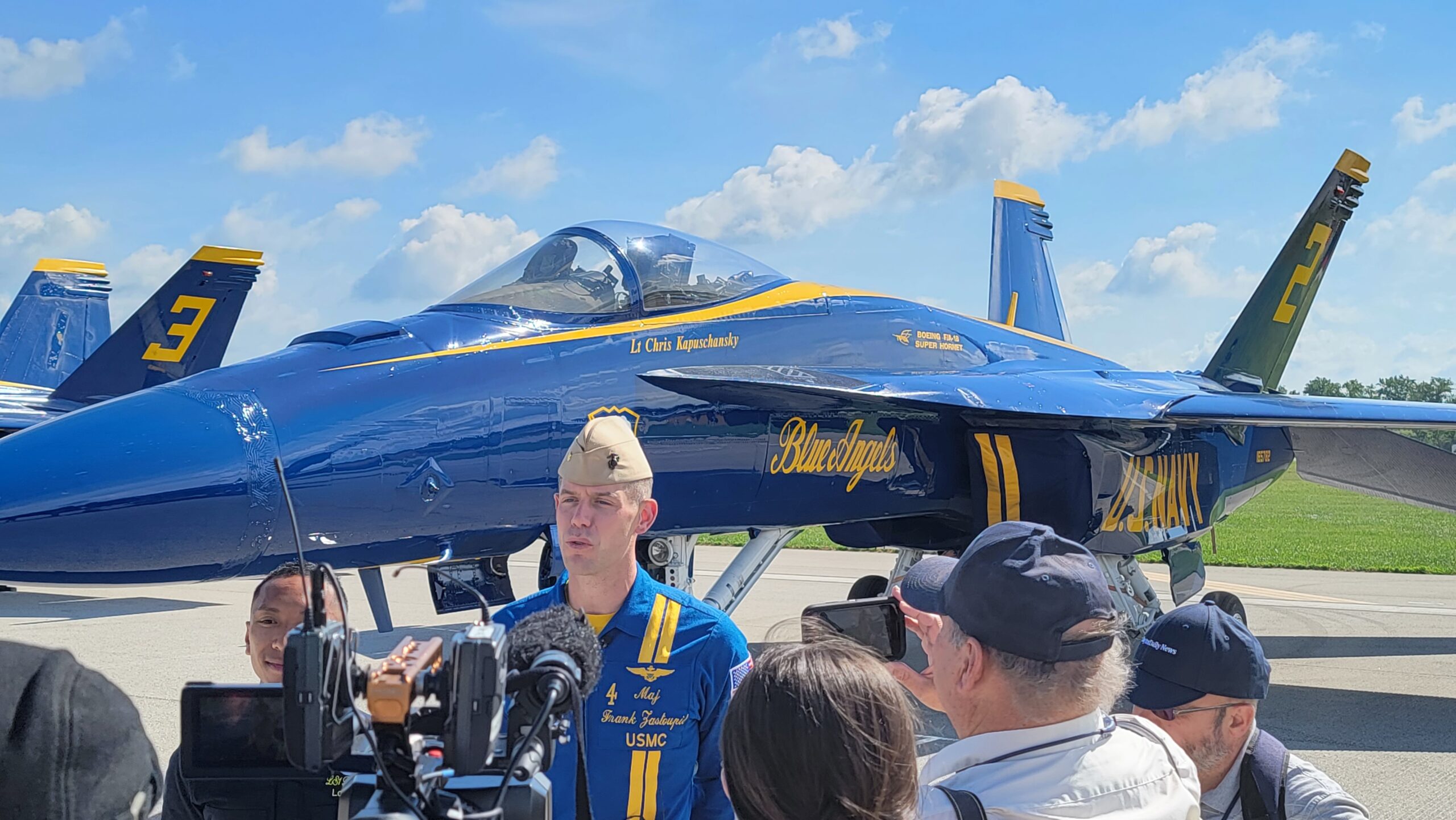 Blue Angels Pilot being interviewed in front of aircraft