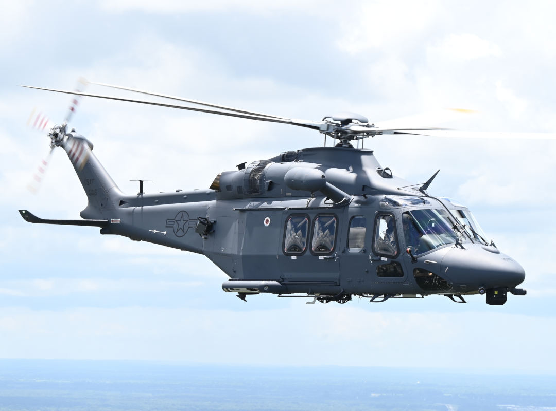 U.S. Air Force MH-139 helicopter flying against a light blue sky.