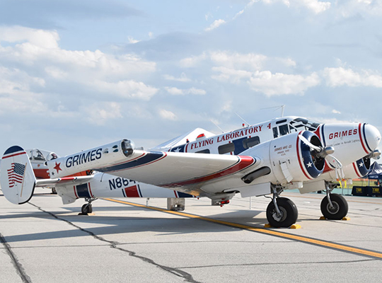 Grimes C-45 Beech 18 aircraft parked on ramp with vintage markings