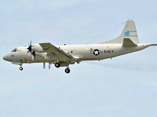 U.S. Navy P-3B Orion in flight against clear sky