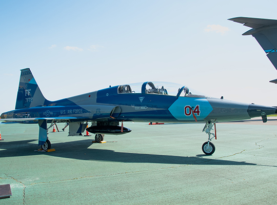 USAF T-38 Talon parked on ramp with blue and gray paint scheme