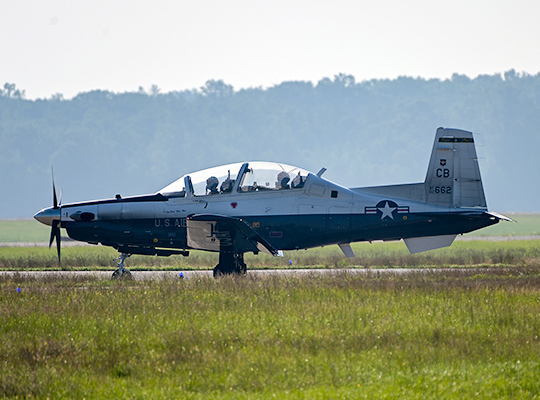 USAF T-6 Texan II training aircraft taxiing on runway